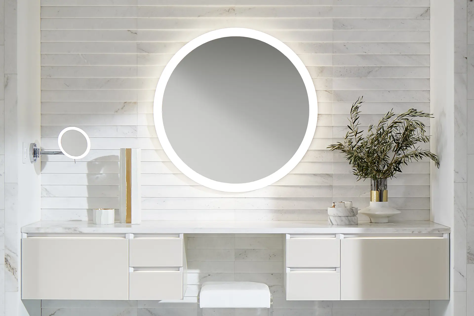 stunning white bathroom with round bathroom mirror and white modular vanity